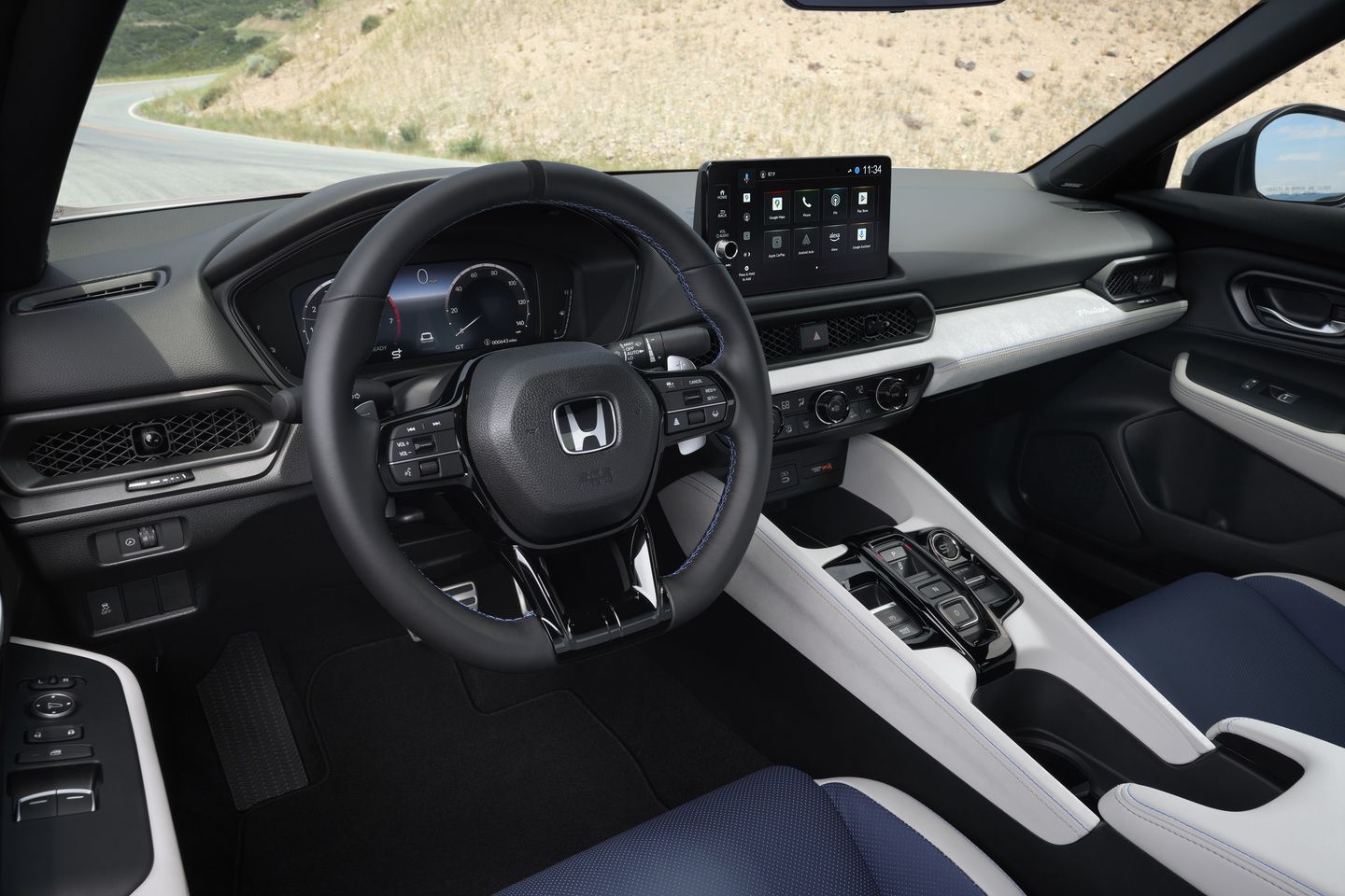 2026 Honda Prelude - Interior view of the cockpit, highlighting the dashboard, steering wheel, and infotainment system. - Orangeville Honda - New car dealership in Orangeville, Ontario