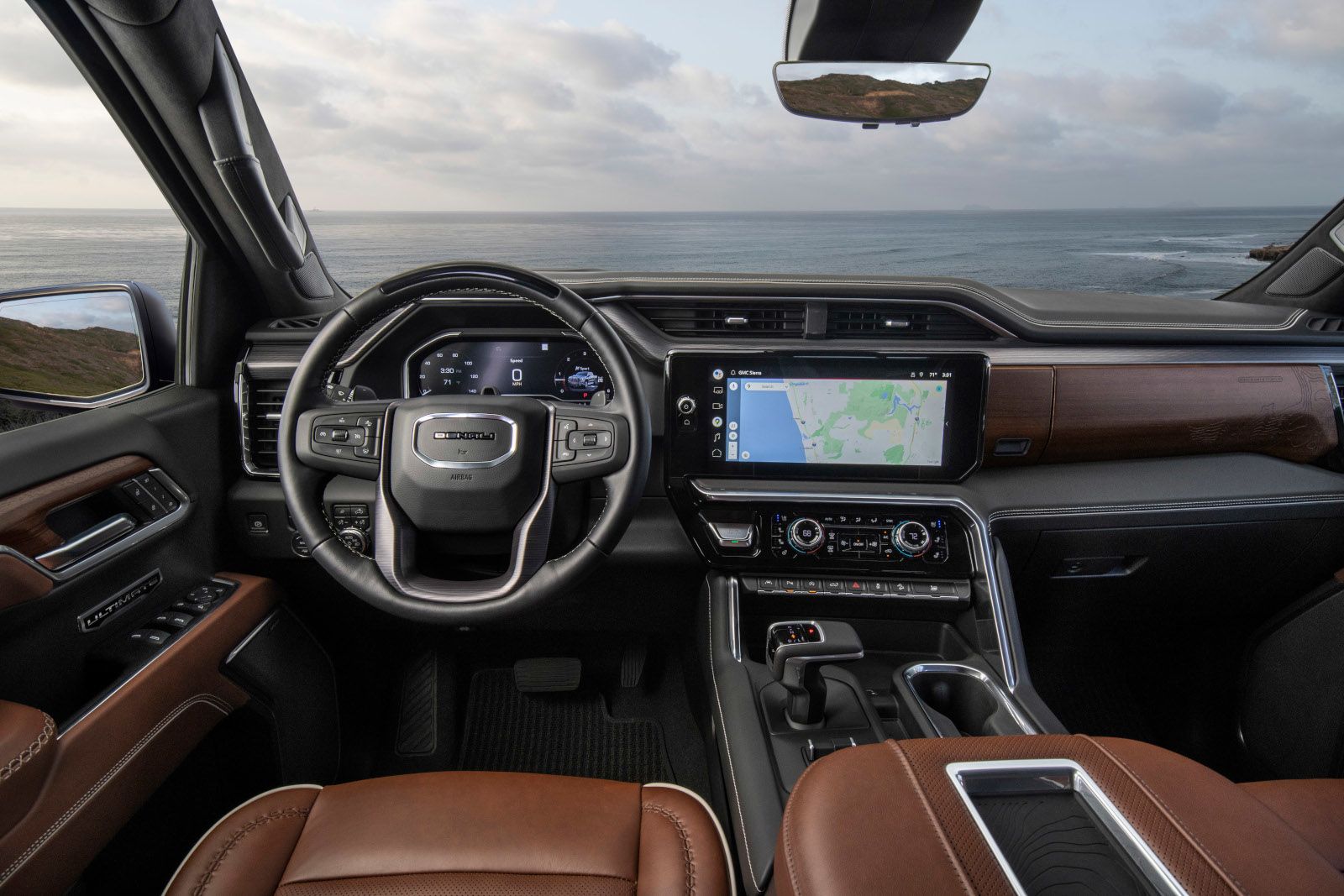 2026 GMC Sierra 1500 Denali Ultimate - Interior view of the cockpit, showcasing the dashboard, infotainment screen, and brown leather interior - City Chevrolet Buick GMC - New car dealership in Toronto, Ontario