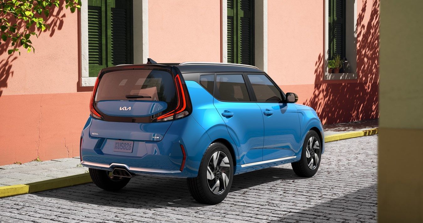 Kia Soul - A blue Kia Soul with a black roof, shown from the rear-three-quarter angle, parked on a cobblestone street - AutoPark Barrie - Used car dealership in Barrie, Ontario
