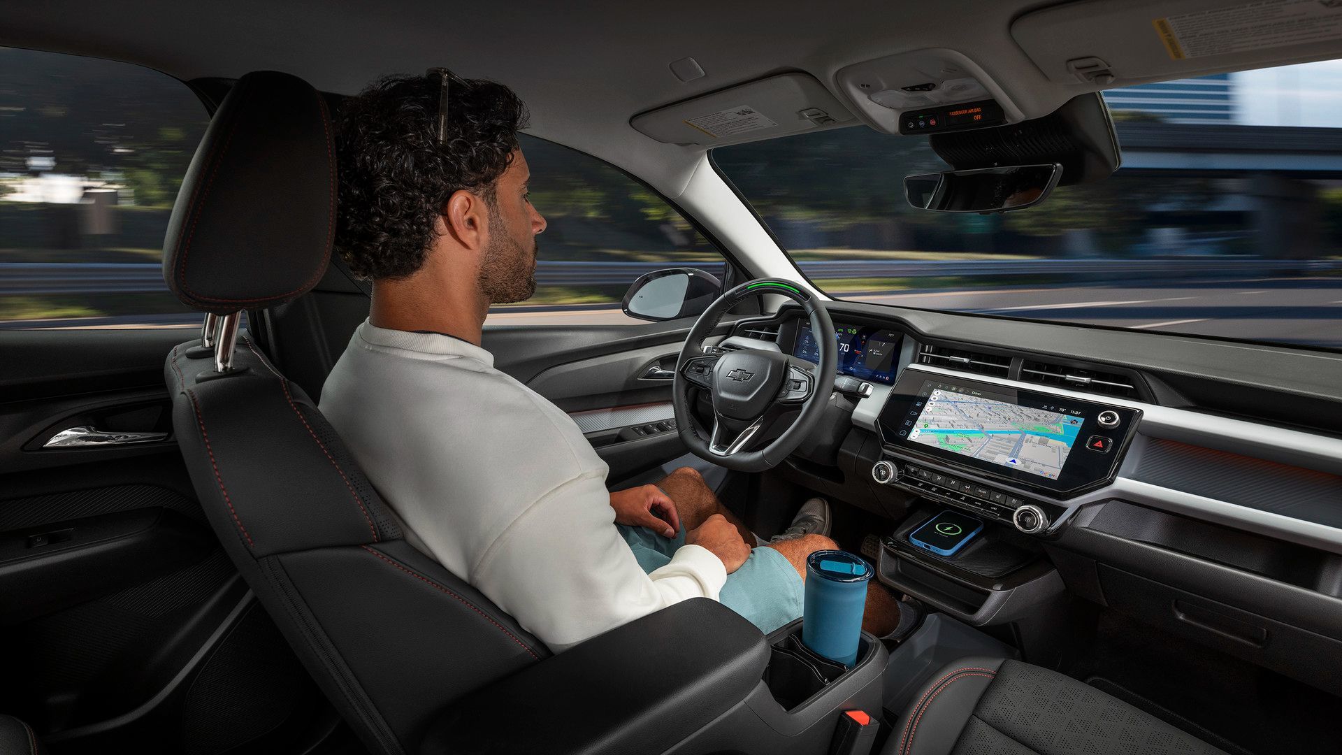 2027 Chevrolet Bolt - Interior view of the Chevrolet Bolt dashboard, infotainment screen, and steering wheel.