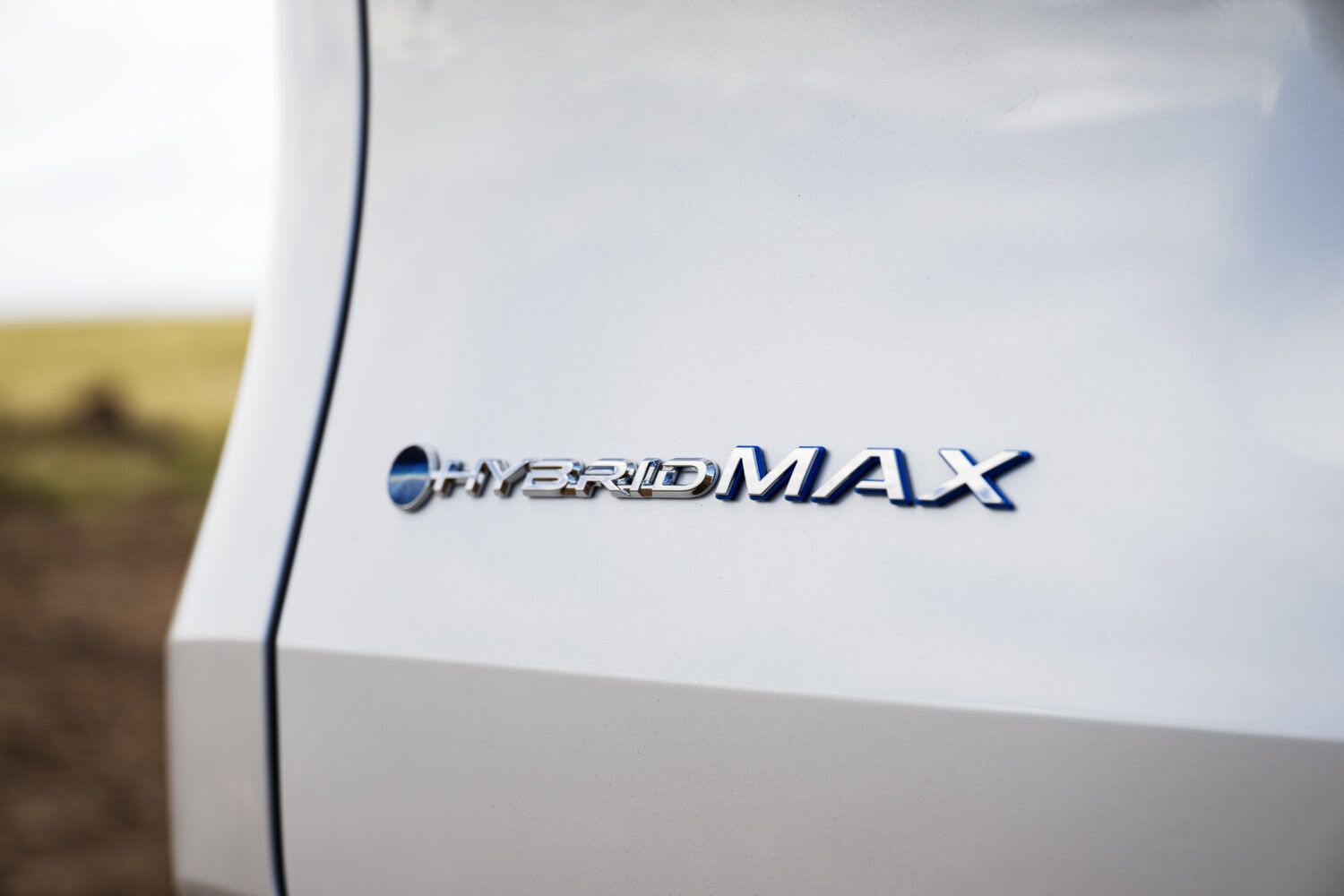 2026 Toyota Grand Highlander - Close-up of the Hybrid MAX badge on the tailgate of the 2026 Toyota Grand Highlander - Orangeville Toyota - Toyota new car dealership in Orangeville, Ontario