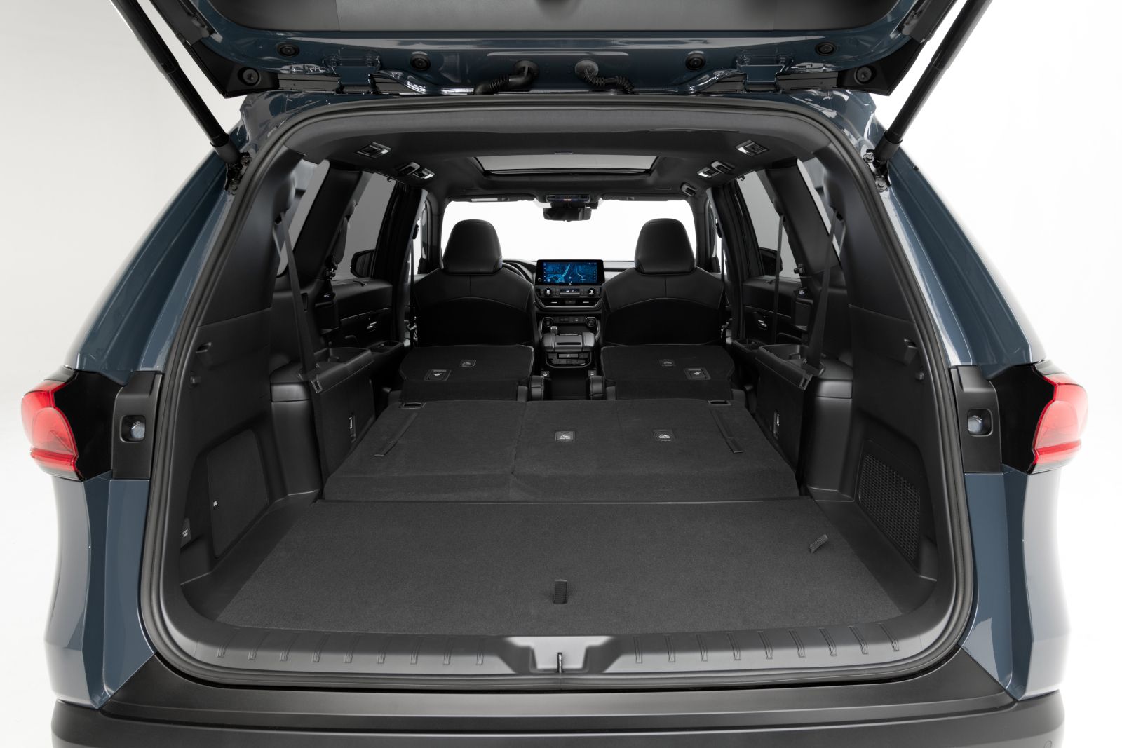 2026 Toyota Grand Highlander - View of the spacious rear cargo area of a 2026 Toyota Grand Highlander with the third-row seats folded down - Orangeville Toyota - Toyota new car dealership in Orangeville, Ontario