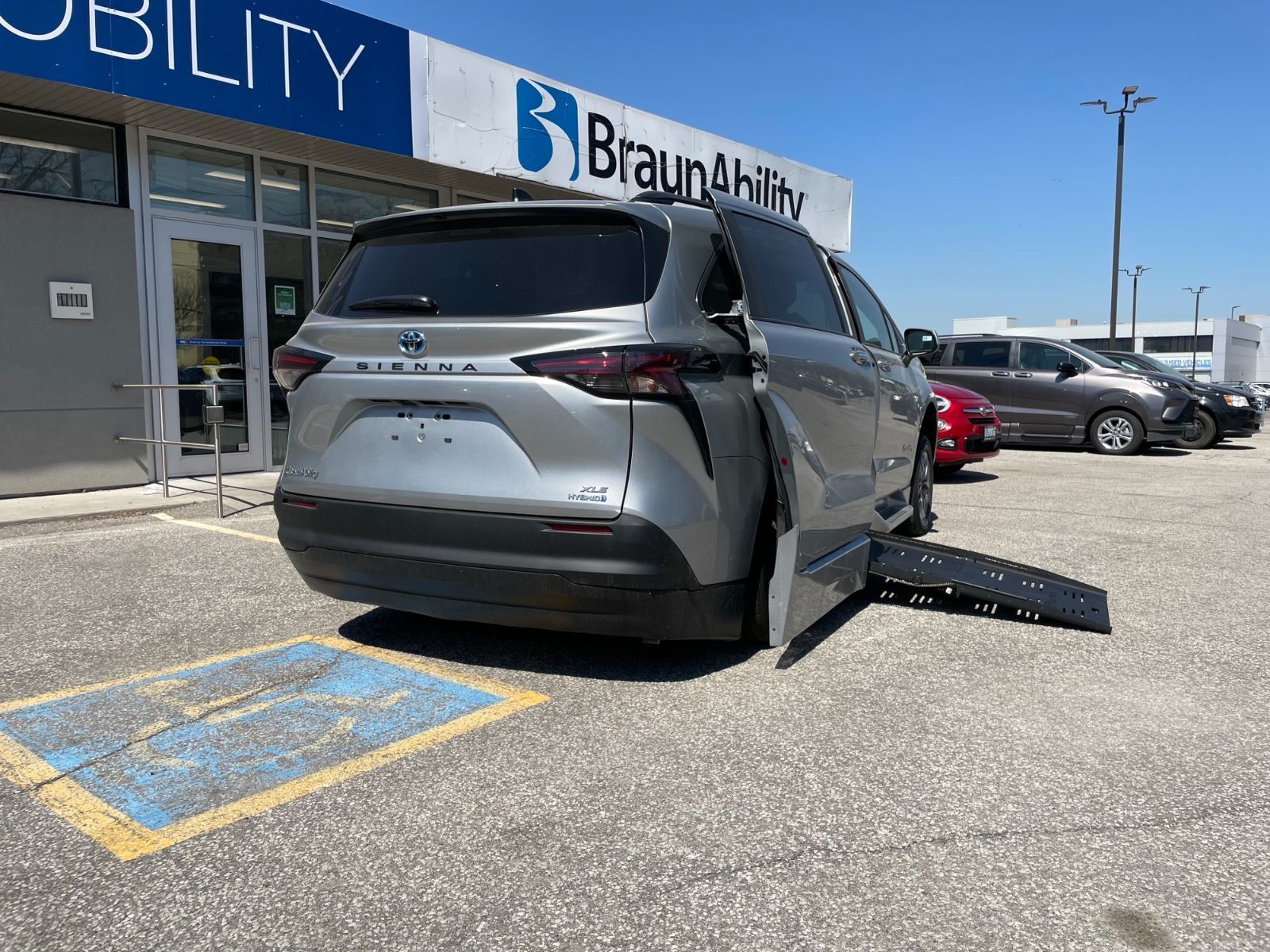 Toyota Sienna - Rear view with the wheelchair ramp extended - Courtland Mobility - Accessible vehicle dealership in Burlington, On