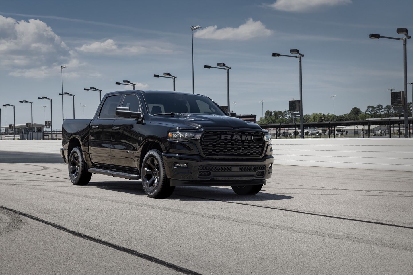 2026 Ram 1500 - A black Ram 1500 parked on an asphalt track - Humberview Group - New car dealerships in Ontario