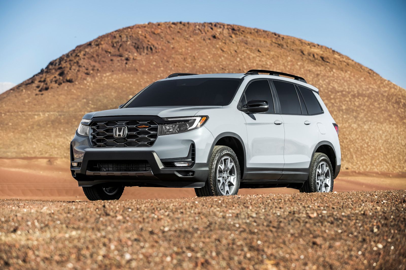2026 Honda Passport TrailSport - A grey Honda Passport TrailSport parked in the desert - Humberview Group - New car dealerships in Ontario