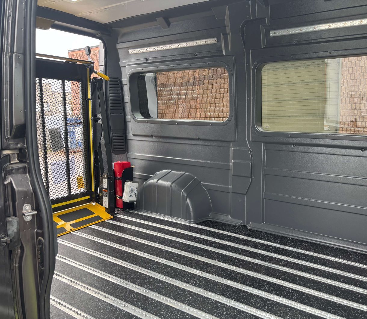 2026 Ram ProMaster - interior view of a 2026 Ram ProMaster cargo area featuring a rear hydraulic wheelchair lift - Courtland Mobility - Accessible car dealership in Burlington, Ontario