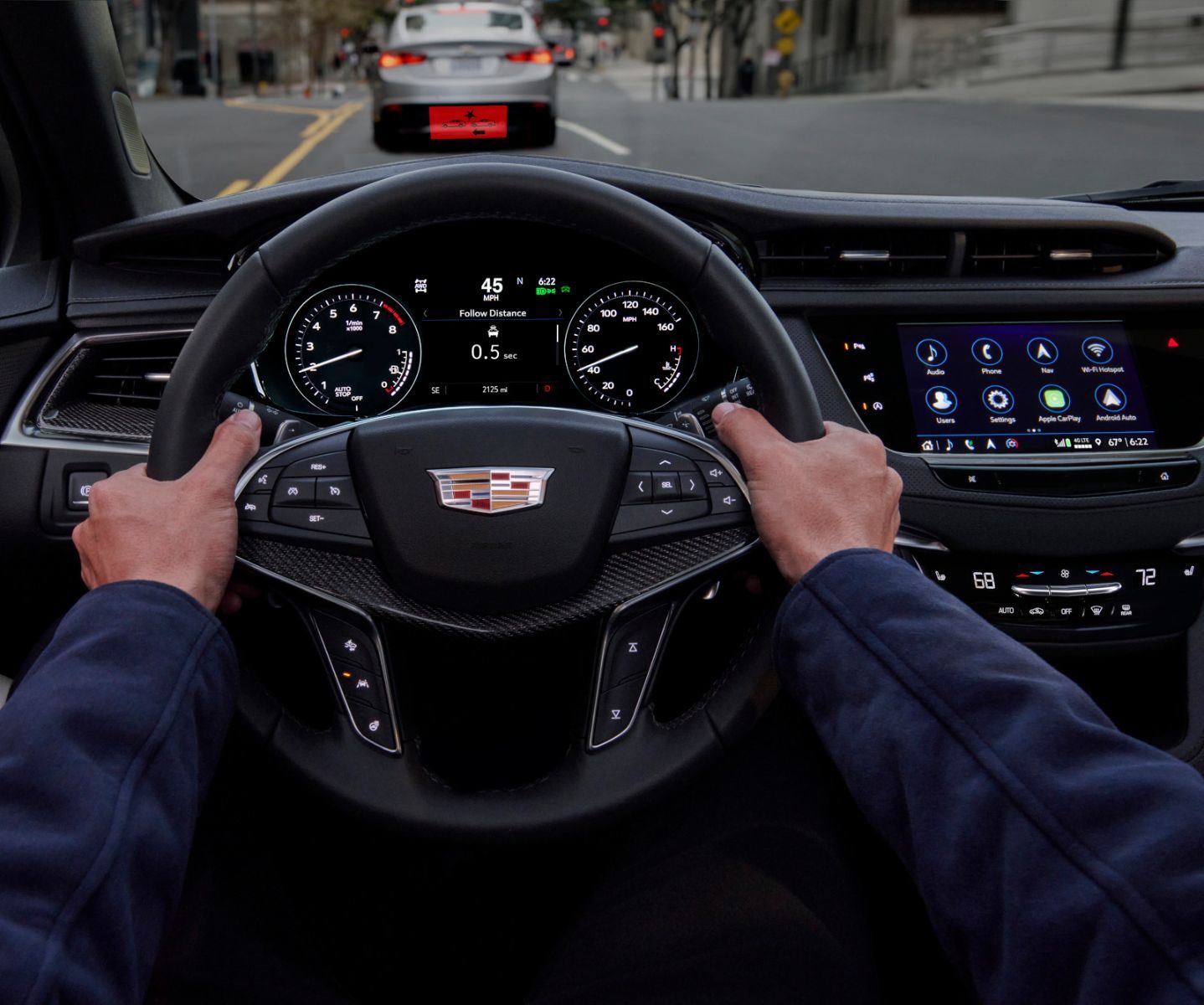 2026 Cadillac XT5 - driver's perspective view of the steering wheel and dashboard while driving - Applewood Cadillac - New car dealership in Mississauga, Ontario