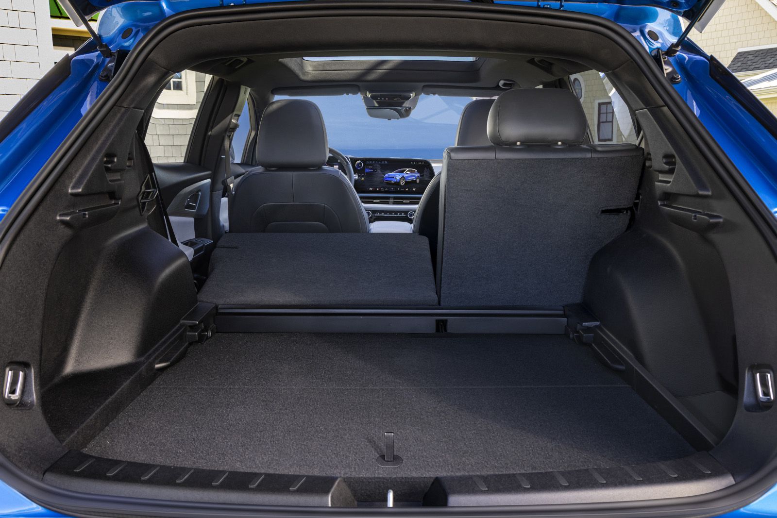 2026 Chevrolet Equinox EV - view of the open cargo area with the rear seats folded down - City Chevrolet, Buick, GMC - New car dealership in Toronto, Ontario
