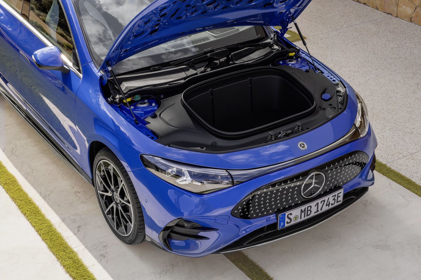 2026 Mercedes-Benz CLA - high-angle view of the front of a blue 2026 Mercedes-Benz CLA with the front trunk open - Mercedes-Benz Brampton - New car dealership in Brampton, Ontario