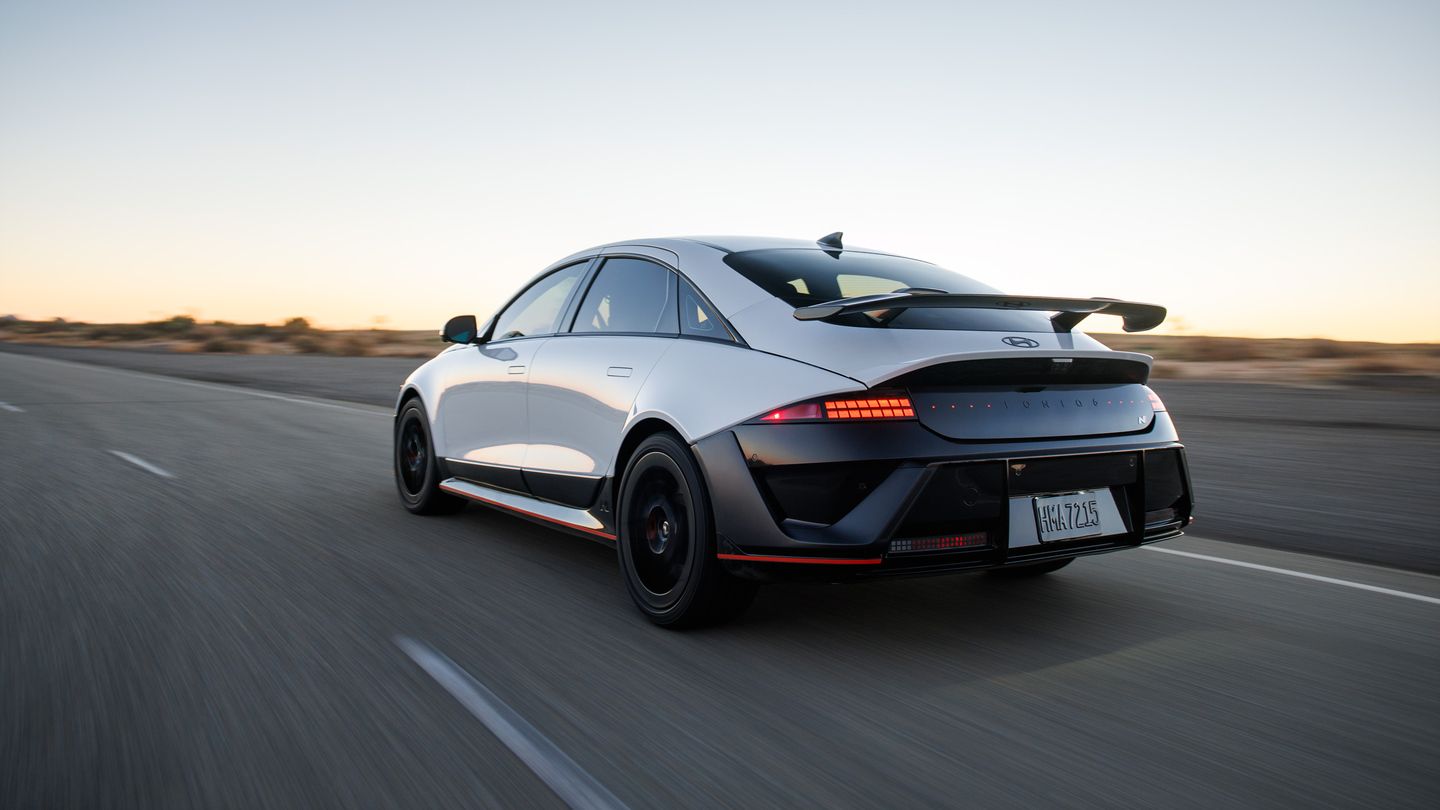 2026 Hyundai IONIQ 6 N - rear view of a white electric sports sedan driving on a highway - Woodstock Hyundai - New car dealership in Woodstock, Ontario