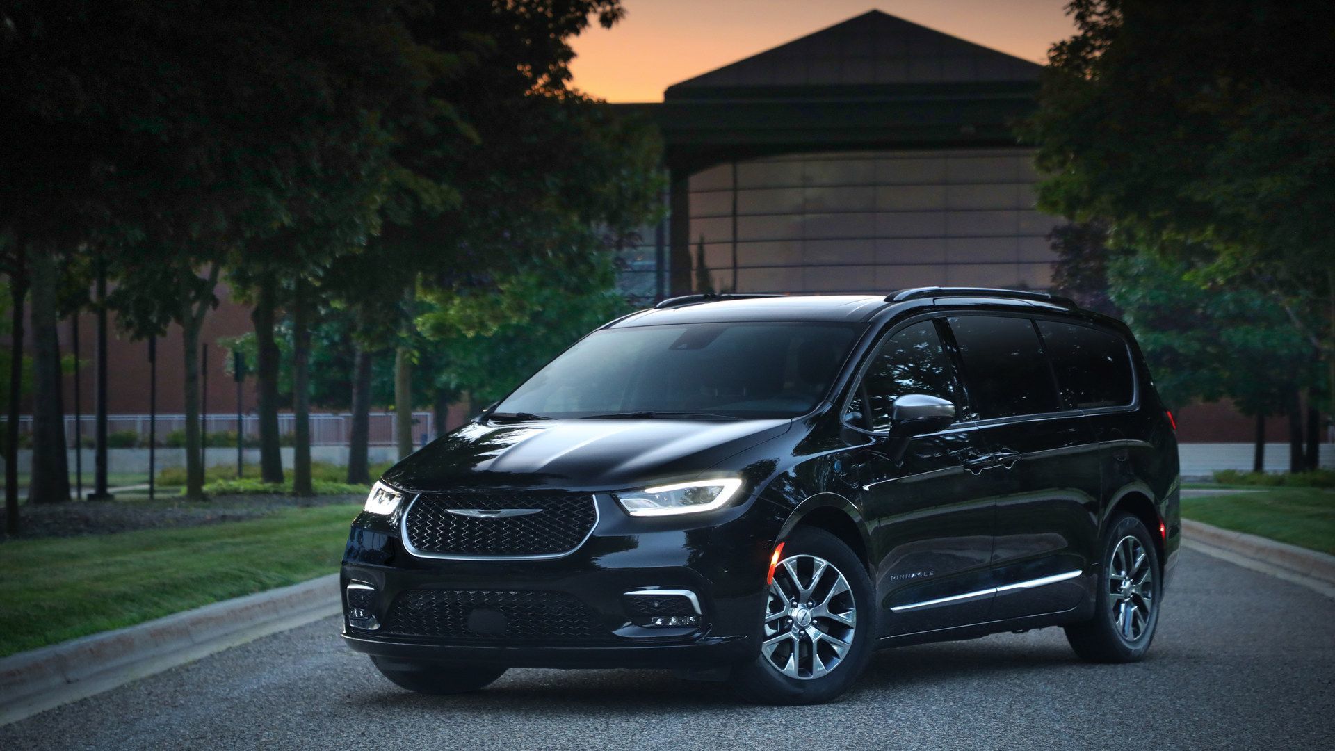 2026 Chrysler Pacifica - a black 2026 Chrysler Pacifica parked on a paved road at dusk - Humberview Group - New car dealerships in Ontario