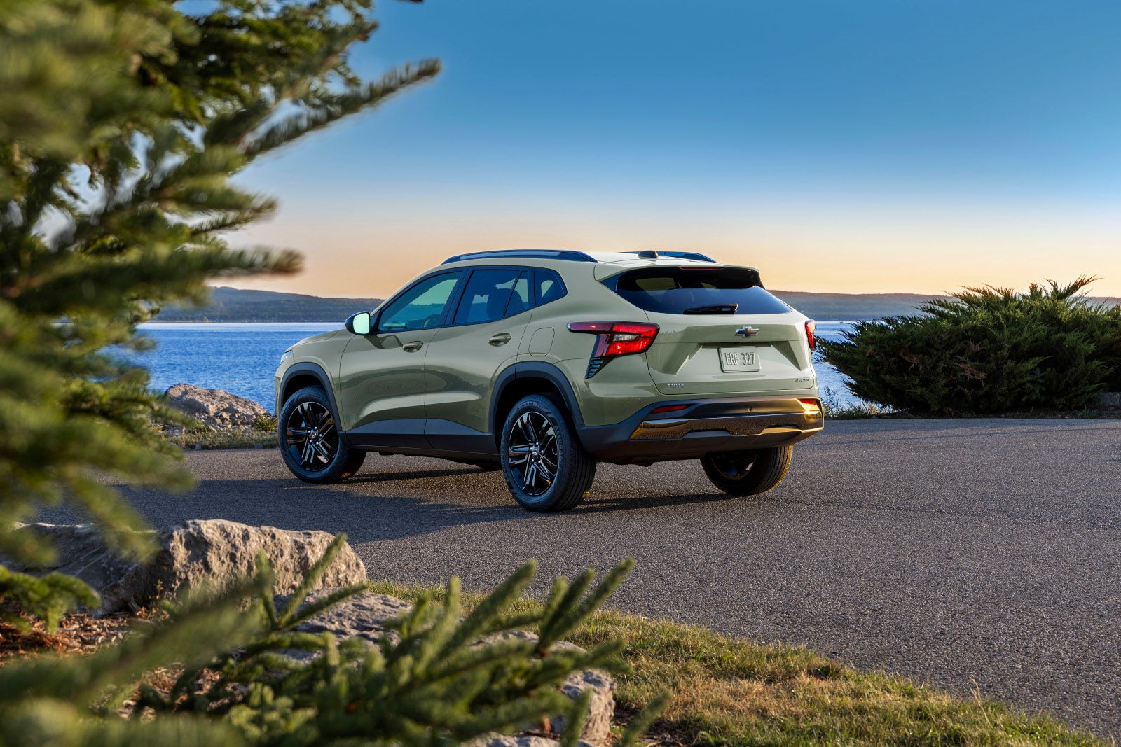 2026 Chevrolet Trax - rear view of a green Trax Activ parked near a lake - City Chevrolet, Buick, GMC - New car dealership in Toronto, Ontario