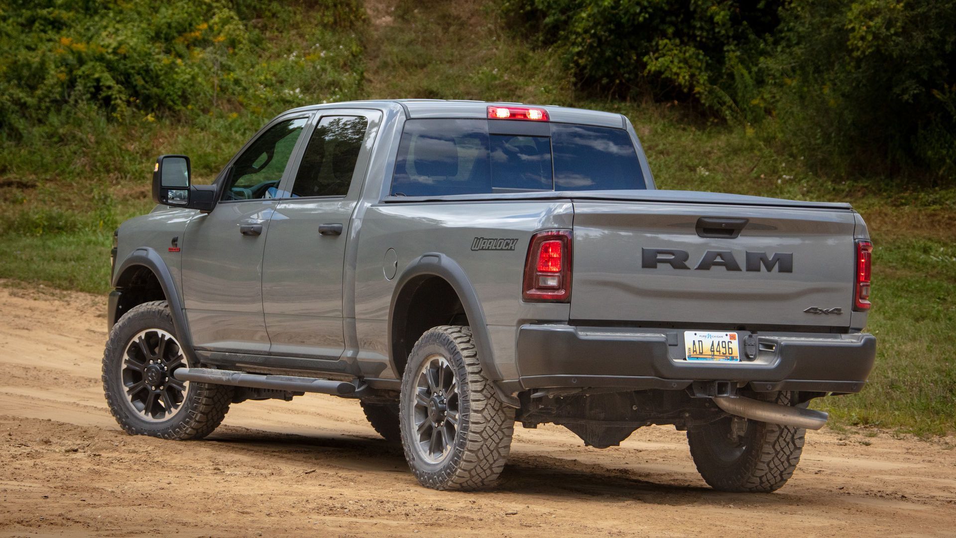 2026 Ram 2500 Warlock - rear view of a grey 2026 Ram 2500 Warlock parked on a dirt road - Cooksville Chrysler, Jeep, Dodge, Ram - New car dealership in Mississauga, Ontario