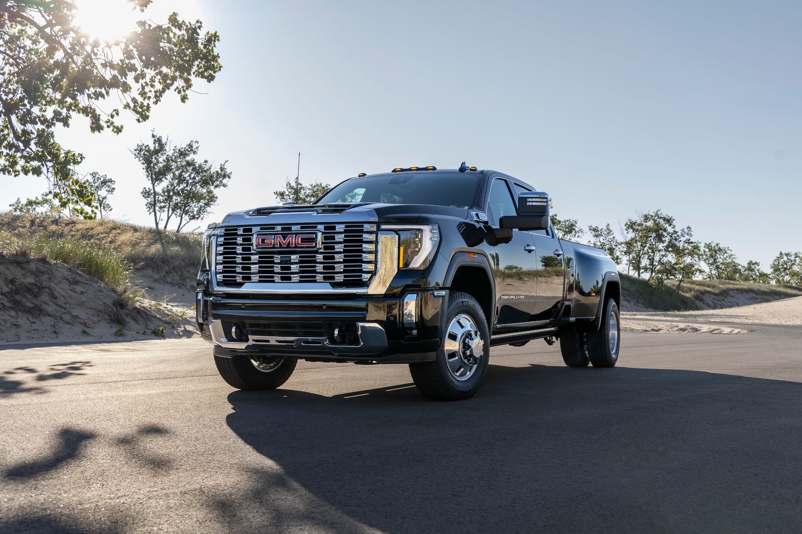 2026 GMC Sierra 3500 HD - front view of a black 2026 GMC Sierra 3500 HD Denali dually parked on a road - City Chevrolet Buick GMC - New car dealership in Toronto, Ontario