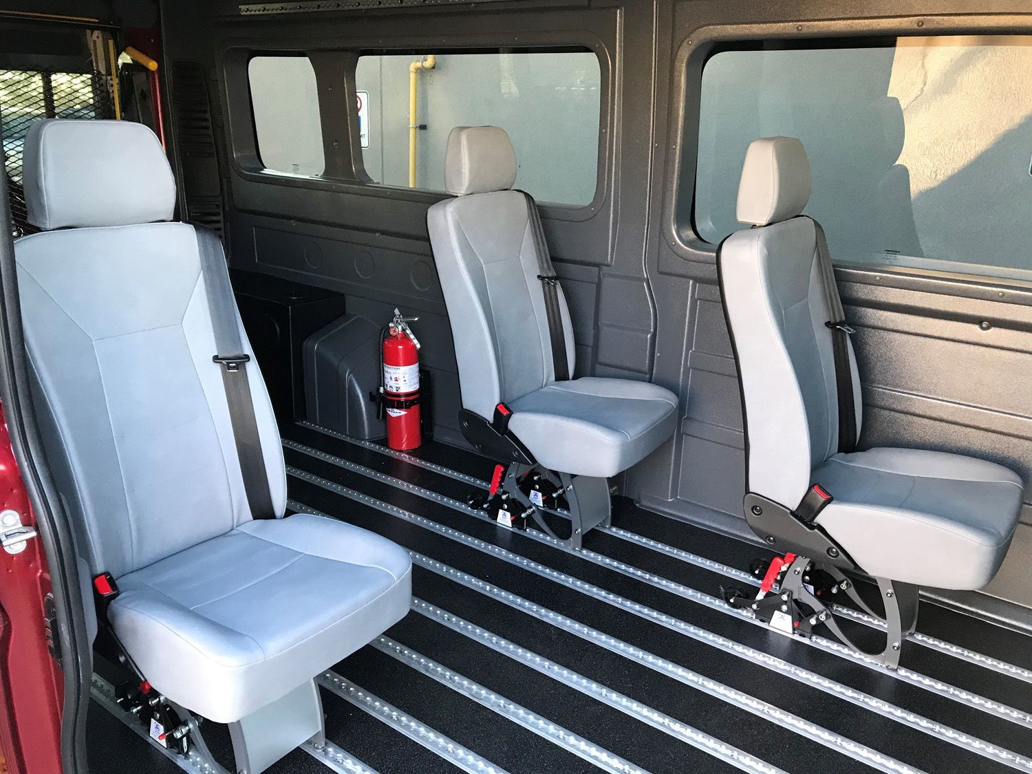 2026 Ram ProMaster - interior view of the 2026 Ram ProMaster showing the wheelchair-accessible track flooring and seats - Courtland Mobility - Accessible car dealership in Burlington, Ontario