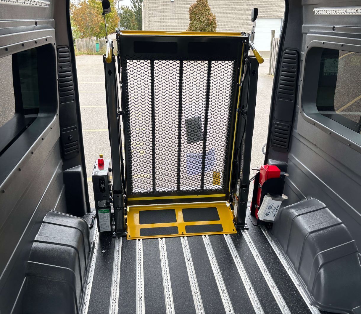 2026 Ram ProMaster - view of the rear wheelchair lift deployed through the open back doors - Humberview Mobility - Accessible car dealership in Toronto, Ontario