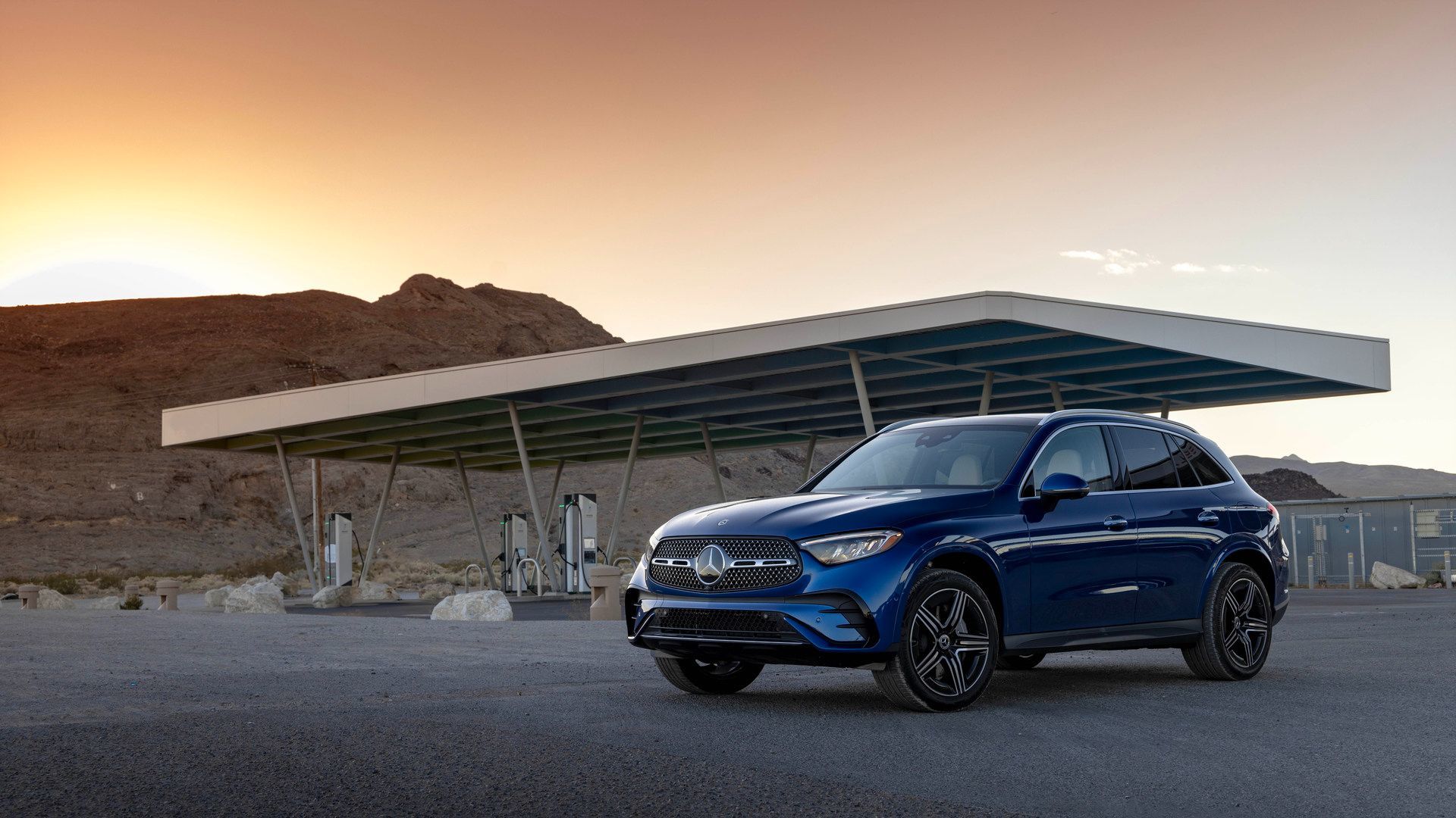 2026 Mercedes-Benz GLC 350e - front quarter view of a blue 2026 Mercedes-Benz GLC 350e plug-in hybrid parked at a charging station - Mercedes-Benz Brampton - New car dealership in Brampton, Ontario