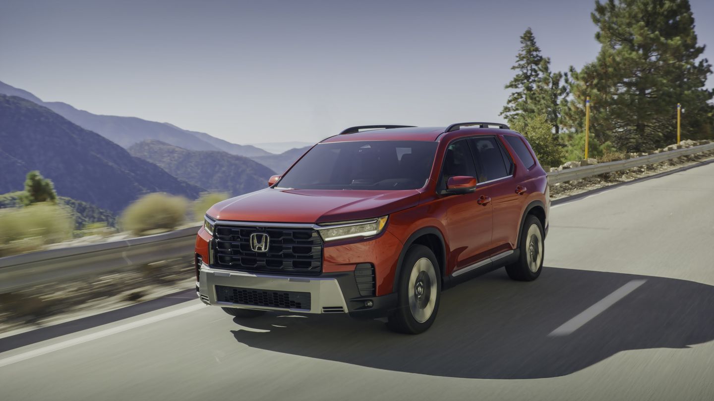2026 Honda Pilot - a red 2026 Honda Pilot driving on a scenic mountain road - Humberview Group - New car dealerships in Ontario