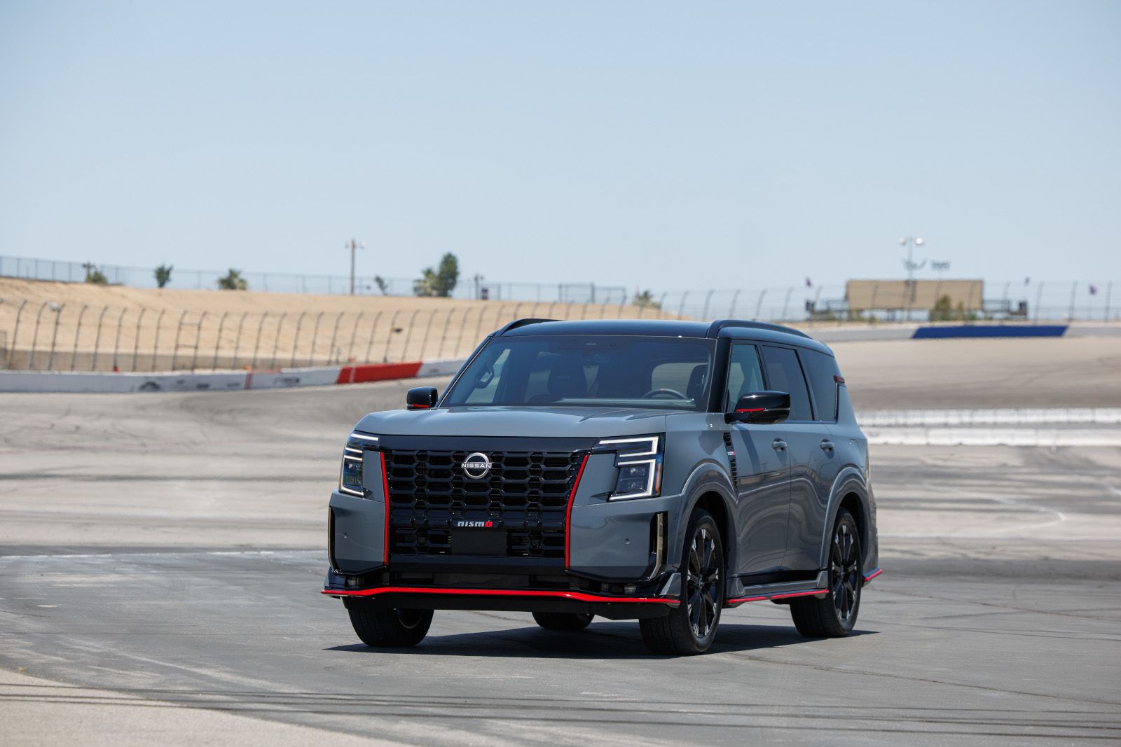 2026 Nissan Armada Nismo - a grey 2026 Nissan Armada Nismo driving on a racetrack - Humberview Group - New car dealerships in Ontario