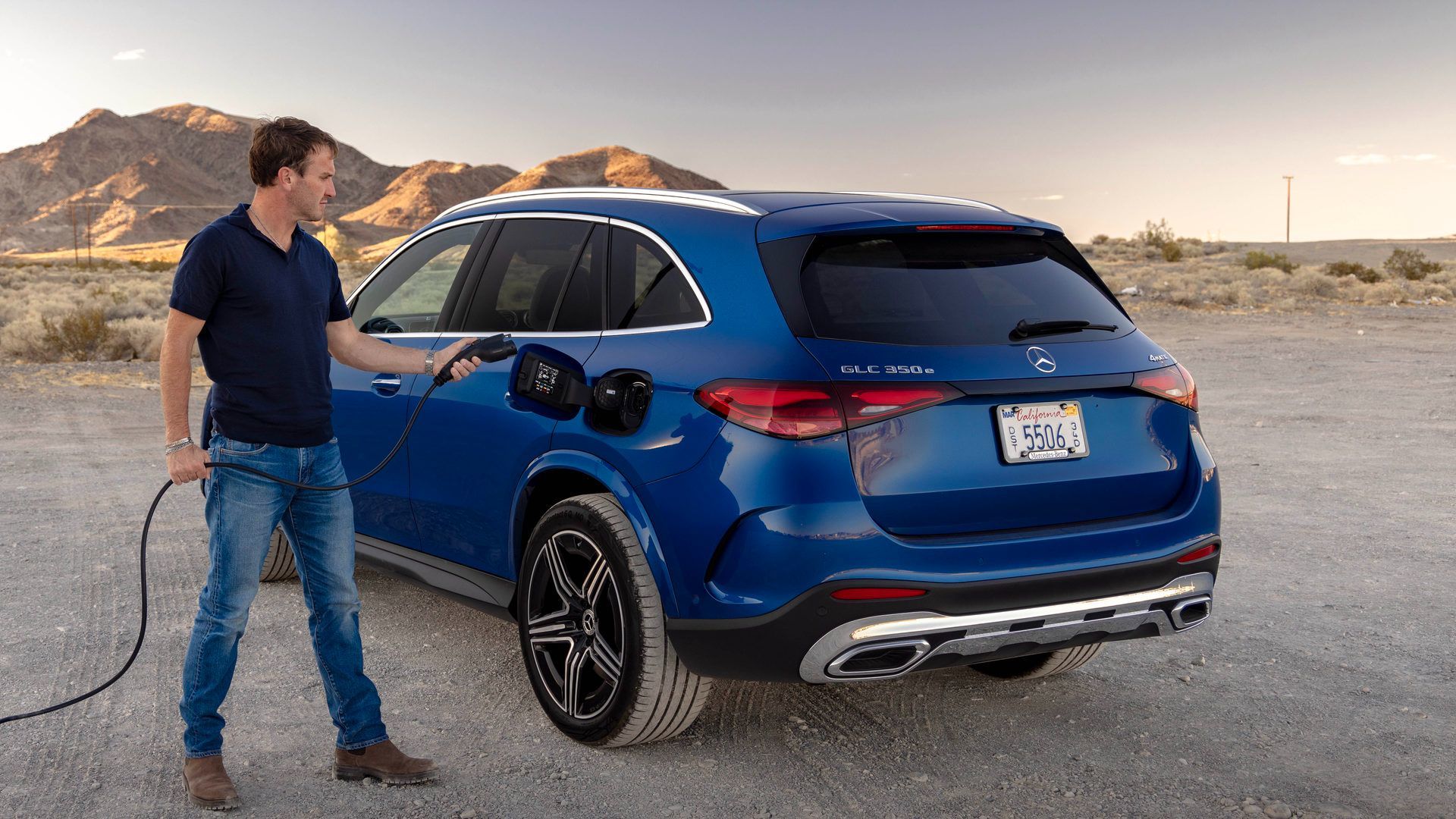 2026 Mercedes-Benz GLC 350e - rear view of a blue 2026 Mercedes-Benz GLC 350e being plugged into a charger - Mercedes-Benz Brampton - New car dealership in Brampton, Ontario