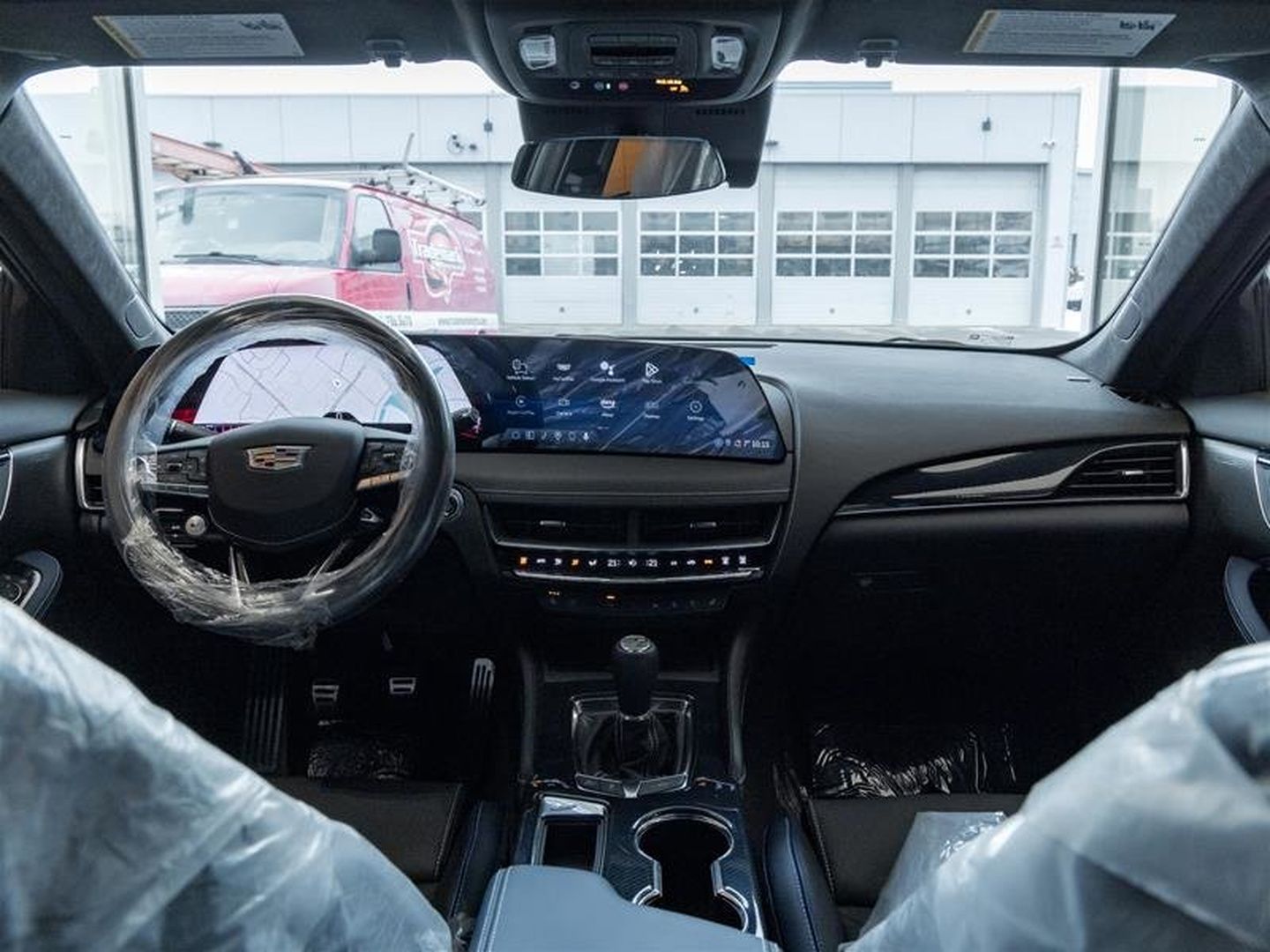 2026 Cadillac CT5-V Blackwing - interior view of the dashboard featuring the large curved infotainment display and steering wheel - Applewood Cadillac - Cadillac new car dealership in Mississauga, Ontario