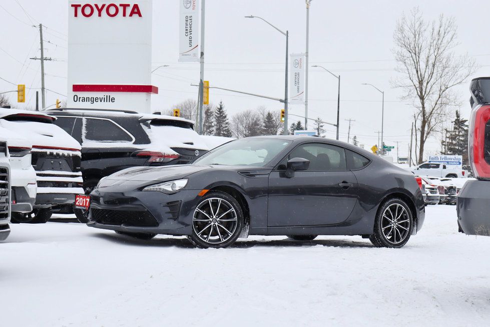 2017 Toyota 86 - a dark grey 2017 Toyota 86 coupe parked in a snow-covered dealership lot - Autopark Brampton - Used car dealership in Brampton, Ontario
