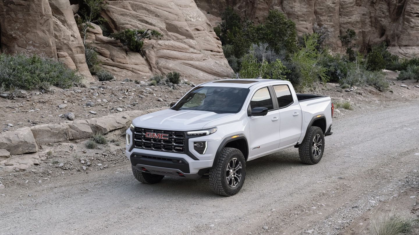 2026 GMC Canyon AT4 - a white GMC Canyon AT4 parked on a gravel trail in a desert canyon - City Chevrolet, Buick, GMC - GMC car dealership in Toronto, Ontario