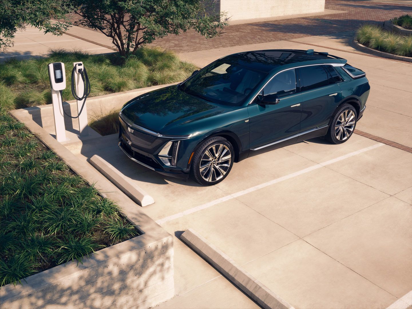 2026 Cadillac Lyriq - a dark green 2026 Cadillac Lyriq parked at an EV charging station - City Cadillac - Cadillac new car dealership in Toronto, Ontario