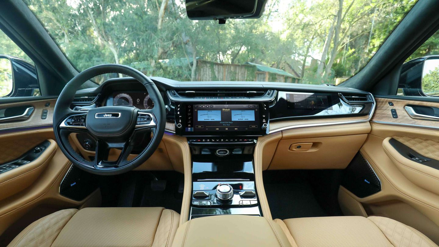 2026 Jeep Grand Cherokee - interior view of the 2026 Jeep Grand Cherokee's tan leather cabin and McIntosh infotainment system - Cooksville Dodge - Jeep new car dealership in Mississauga, Ontario