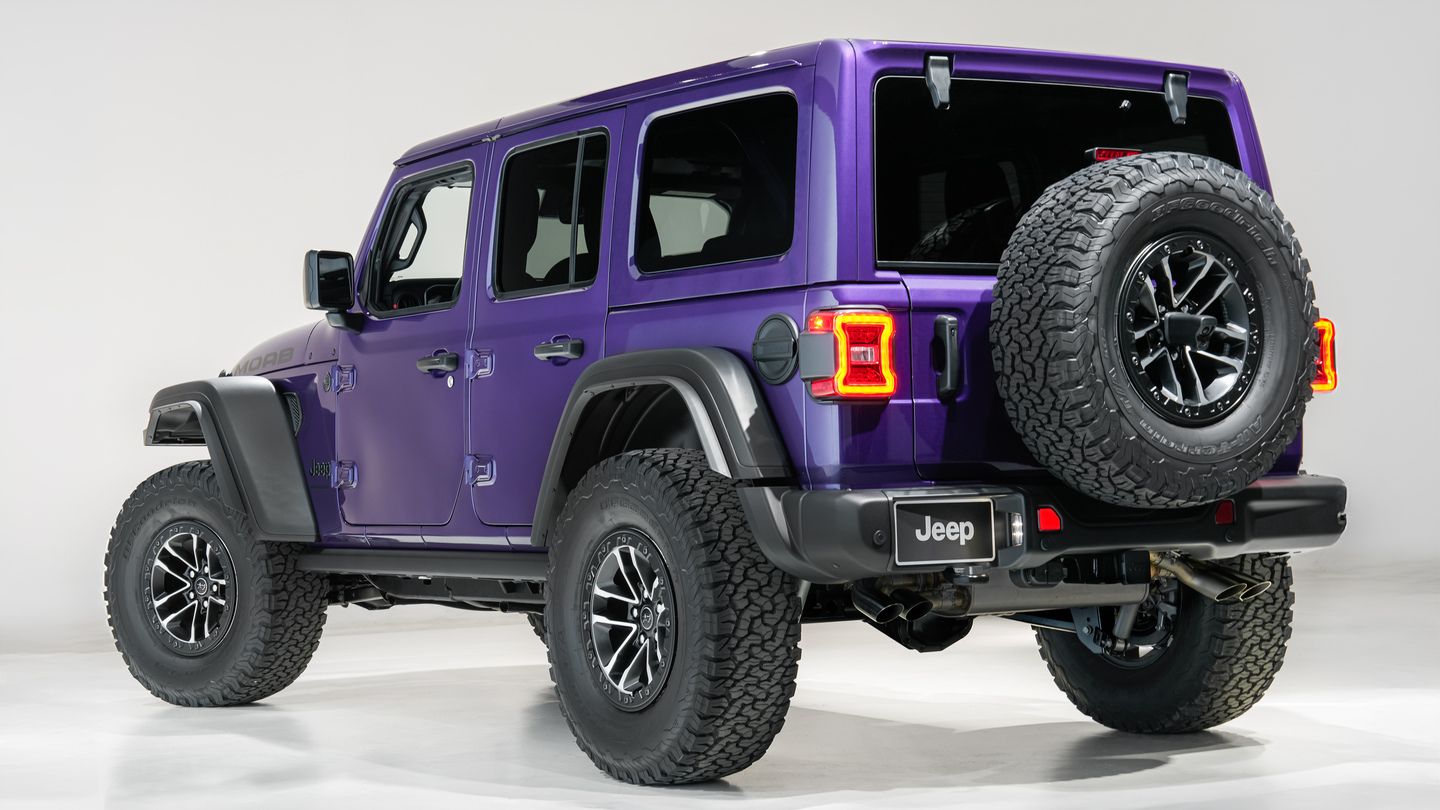 2026 Jeep Wrangler Moab - rear view of a purple 2026 Jeep Wrangler Moab showing the spare tire in a studio setting - Cooksville Dodge Chrysler - New car dealership in Mississauga, Ontario
