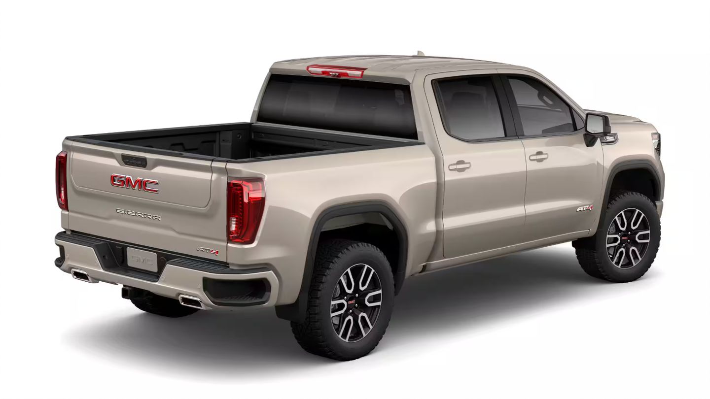 2026 GMC Sierra - rear three-quarter view of a tan 2026 GMC Sierra AT4 showing the MultiPro Tailgate - Humberview Chevrolet, Buick, GMC - New car dealership in Toronto, Ontario