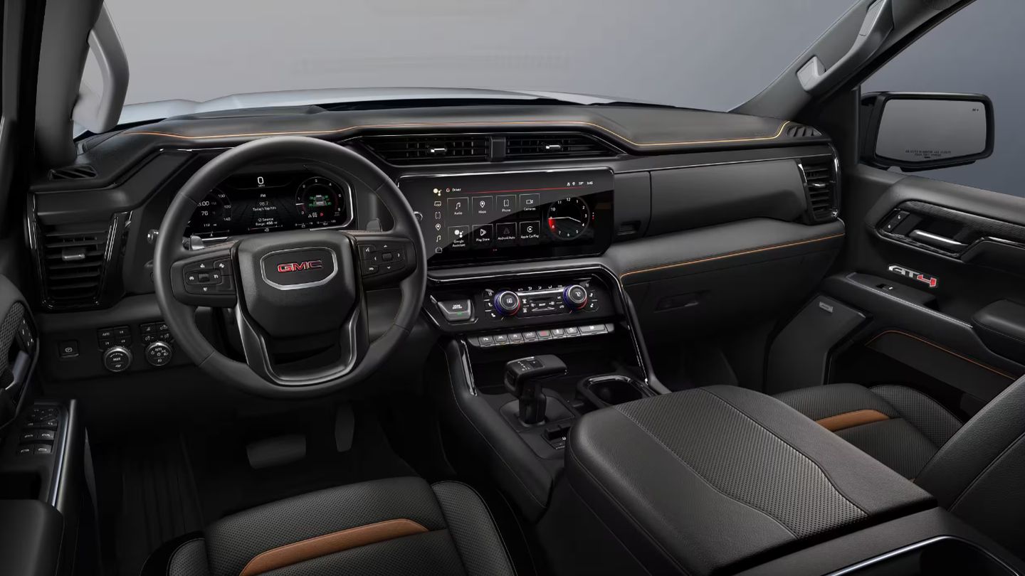 2026 GMC Sierra - interior view of the 2026 GMC Sierra AT4 dashboard, infotainment screen, and steering wheel - Humberview Chevrolet, Buick, GMC - New car dealership in Toronto, Ontario