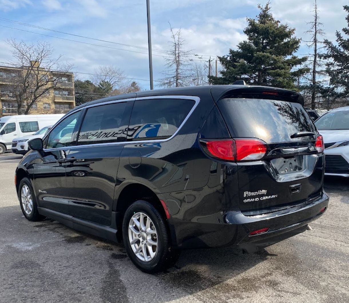 2026 Chrysler Grand Caravan - rear three-quarter view of a black 2026 Chrysler Grand Caravan with a BraunAbility conversion - Courtland Mobility - Chrysler new car dealership in Burlington, Ontario
