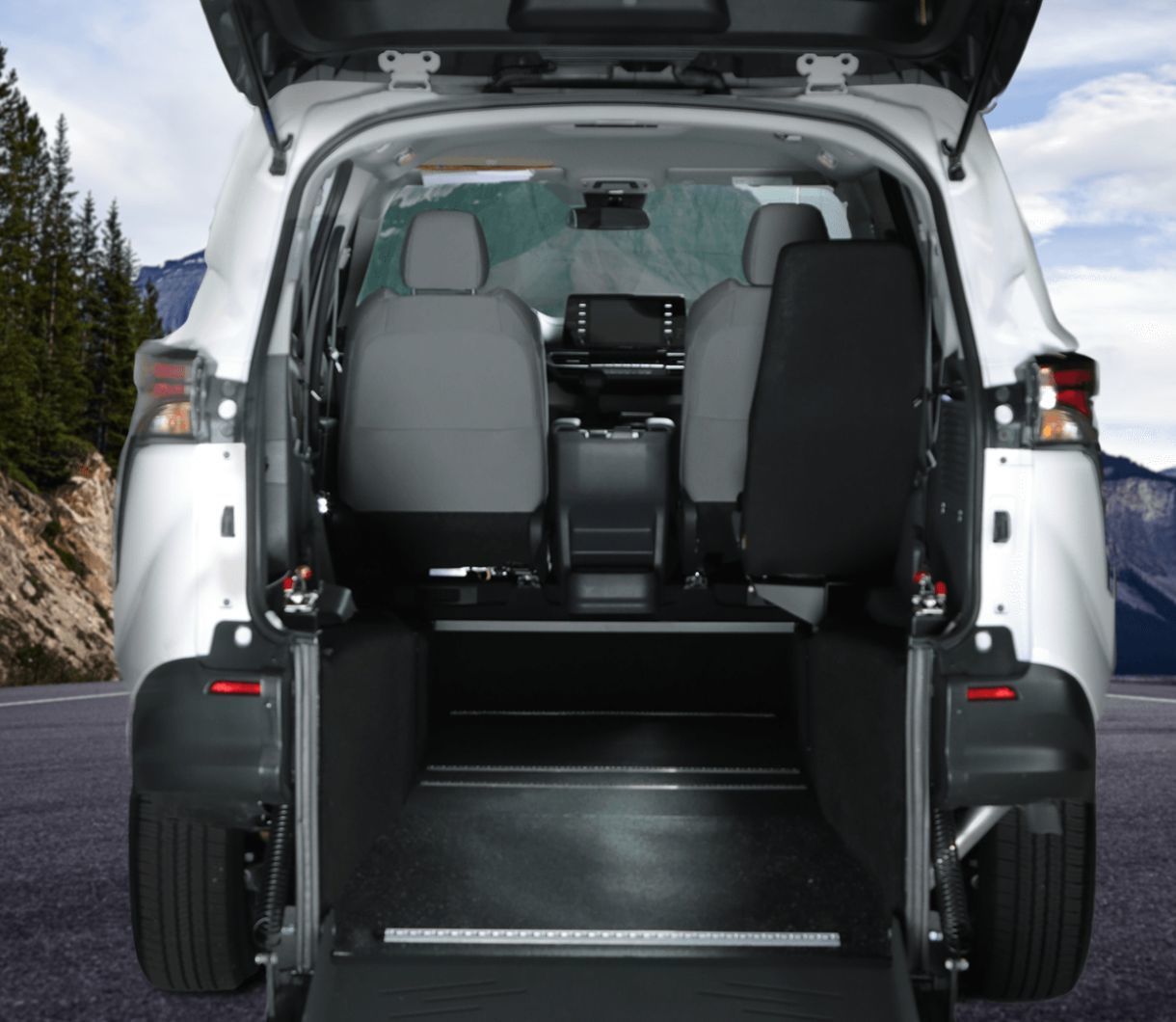2026 Toyota Sienna - interior view from the rear of a white 2026 Toyota Sienna showing the rear-entry wheelchair conversion and interior channel - Humberview Mobility - Toyota new car dealership in Toronto, Ontario