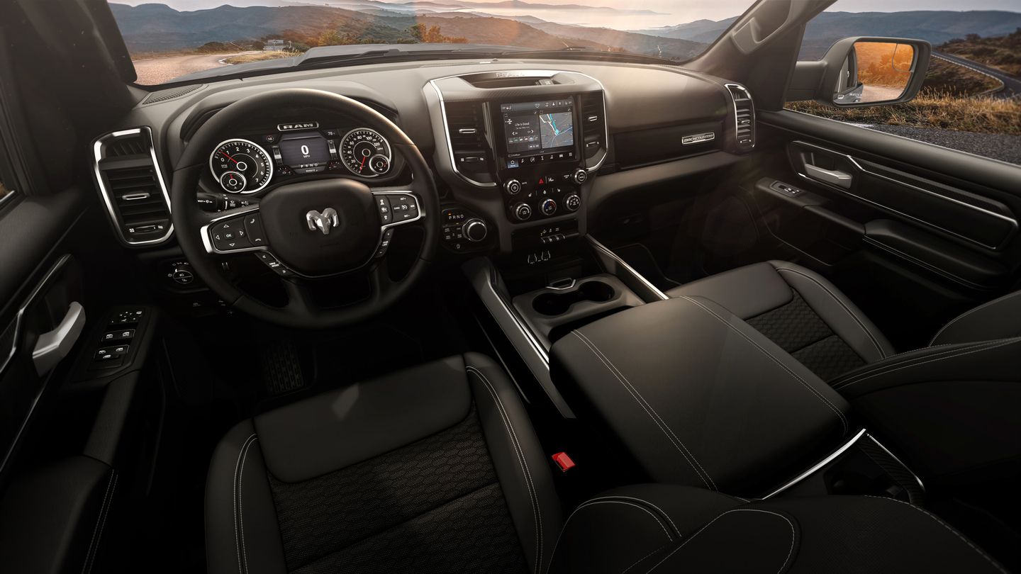 2026 Ram 1500 Back Country - interior view of the 2026 Ram 1500's dashboard, steering wheel, and black leather-trimmed seats - Cooksville Dodge Chrysler - Ram new car dealership in Mississauga, Ontario