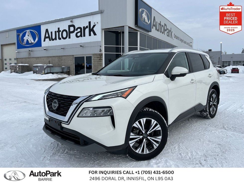 2023 Nissan Rogue - front view of a white Nissan Rogue SUV parked on a snowy lot - AutoPark Barrie - Used car dealership in Barrie, Ontario