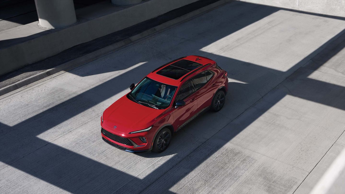 2026 Buick Envision - high-angle view of a red 2026 Buick Envision in a concrete parking area - Humberview Chevrolet, Buick, GMC - New car dealership in Toronto, Ontario
