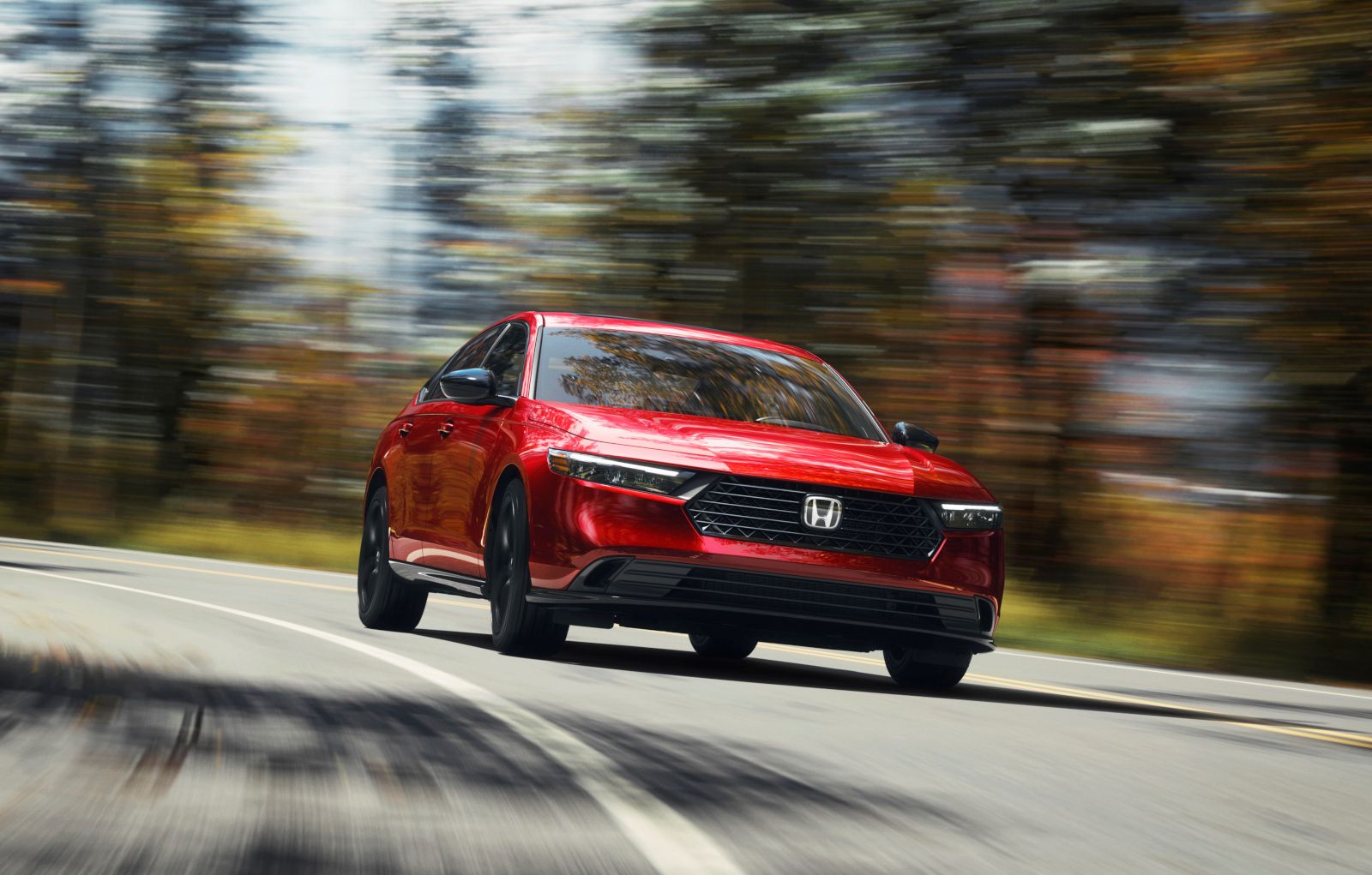 2026 Honda Accord - a red 2026 Honda Accord driving on a paved road with motion blur - Humberview Group - New car dealerships in Ontario