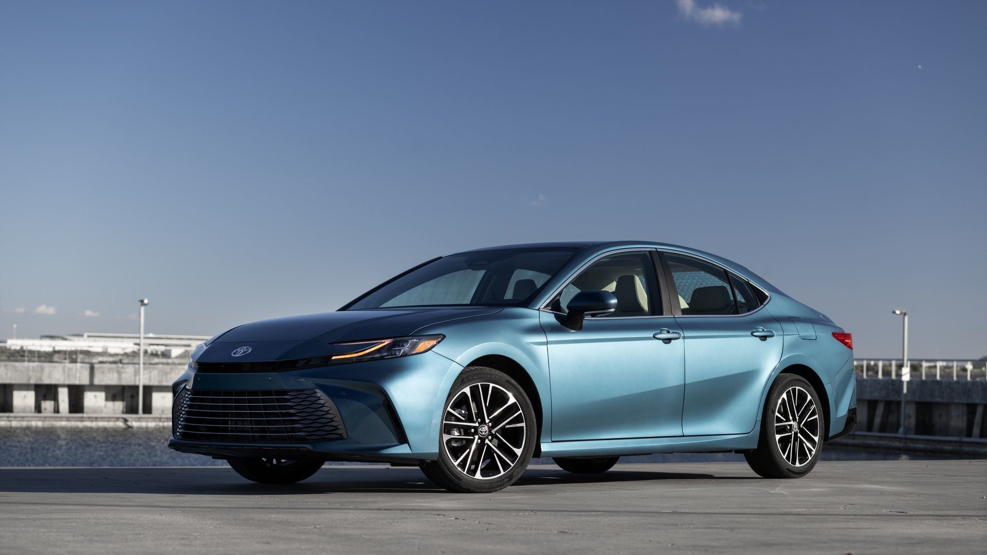 2026 Toyota Camry - a light blue 2026 Toyota Camry XLE AWD parked in a coastal area - Humberview Group - New car dealerships in Ontario