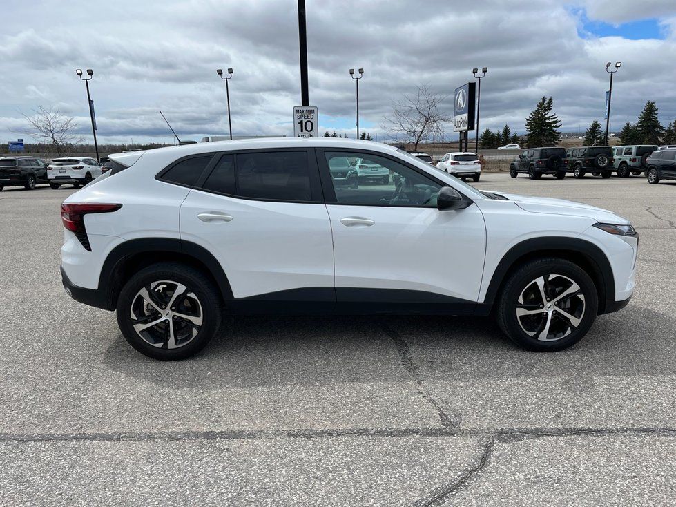 2024 Chevrolet Trax - side profile view of a white 2024 Chevrolet Trax parked outdoors - AutoPark Barrie - Used car dealership in Barrie, Ontario
