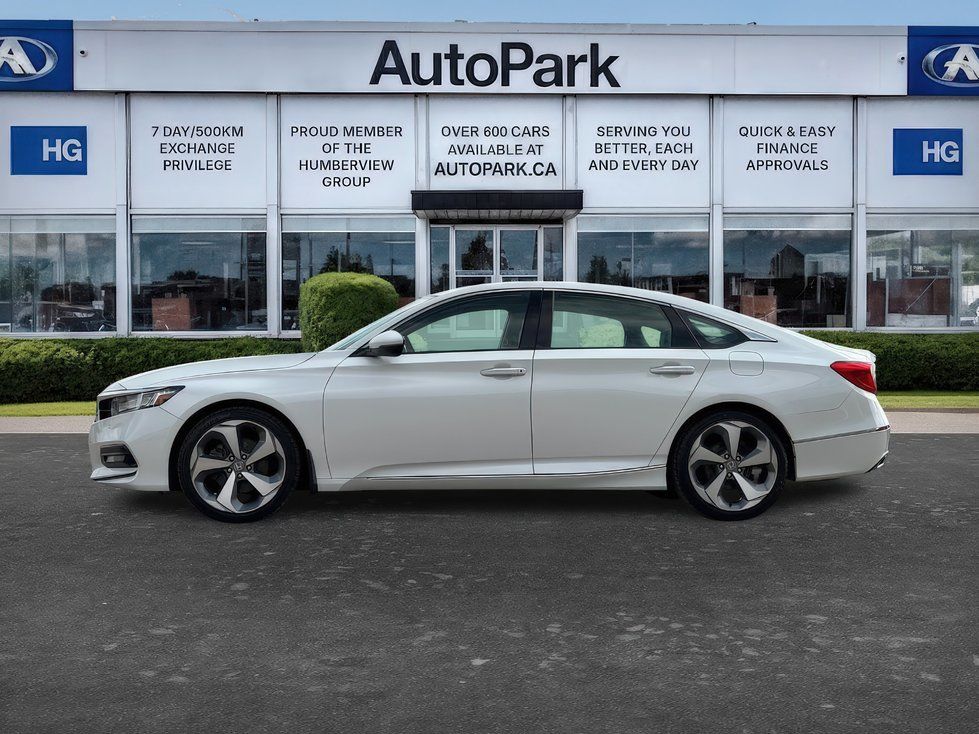 2018 Honda Accord - side profile view of a white 2018 Honda Accord parked in front of the dealership - AutoPark Brampton - Used car dealership in Brampton, Ontario