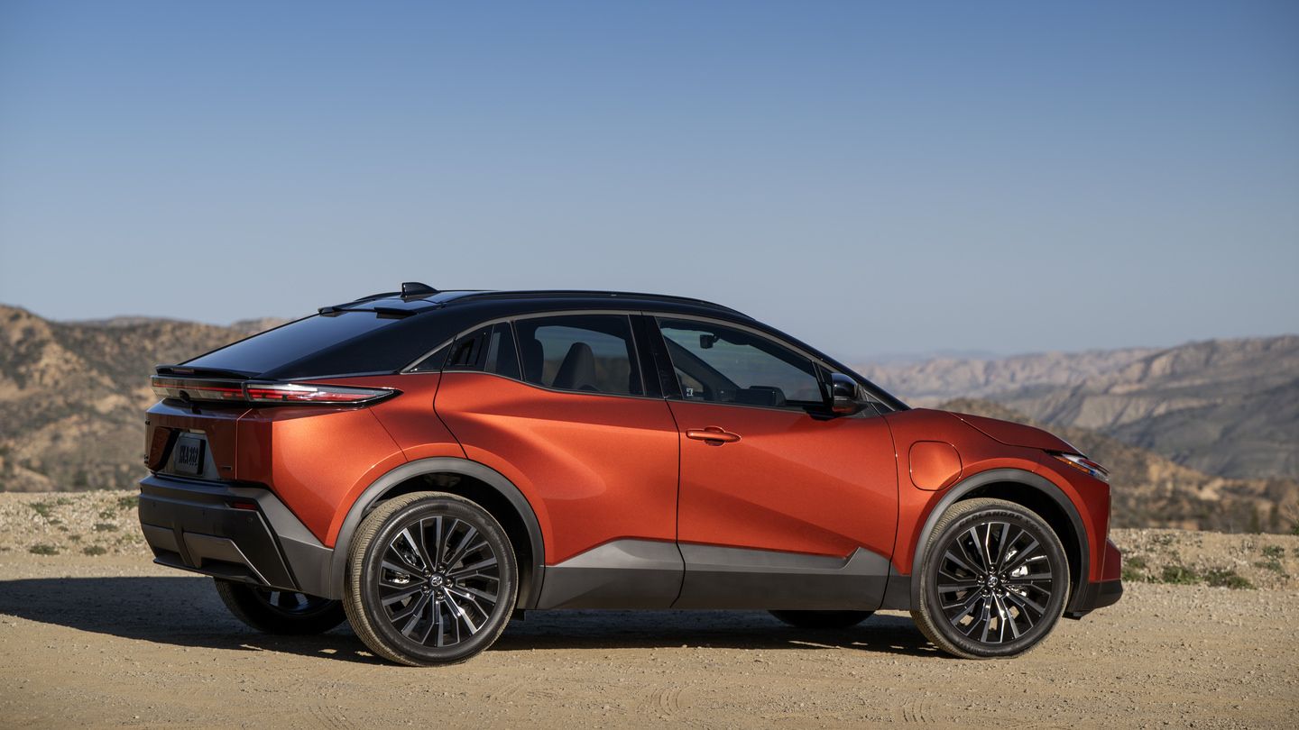 2026 Toyota C-HR - a tandoori orange 2026 Toyota C-HR parked on a dirt lookout with a mountain landscape background - Georgetown Toyota - Toyota new car dealership in Georgetown, Ontario