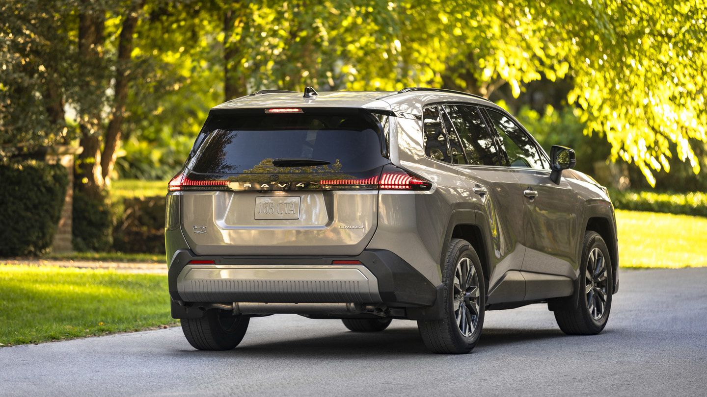 2026 Toyota RAV4 Limited - rear three-quarter view of a tan 2026 Toyota RAV4 Limited parked on a paved driveway - Goderich Toyota - New car dealership in Goderich, Ontario