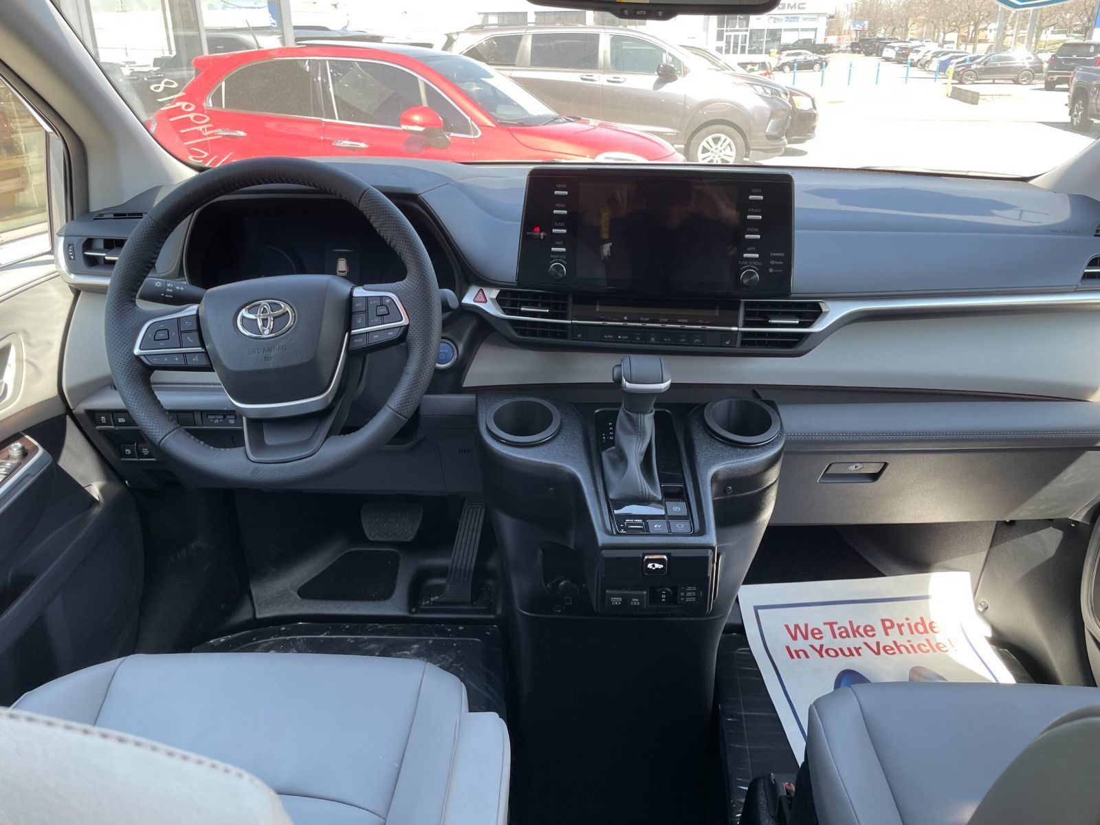 2026 Toyota Sienna - interior view of the 2026 Toyota Sienna dashboard, steering wheel, and center infotainment console - Courtland Mobility - Accessible car dealership in Burlington, Ontario