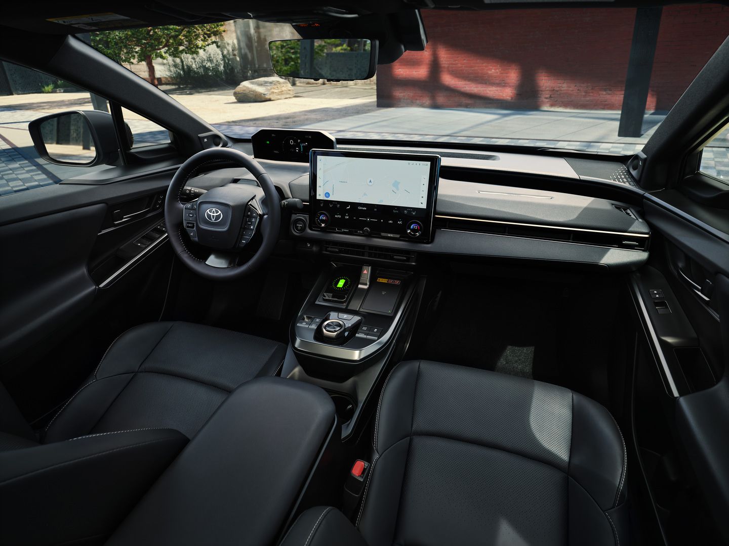2026 Toyota bZ - Interior view of the 2026 Toyota bZ&rsquo;s dashboard, steering wheel, and infotainment screen - Oakville Toyota - New car dealership in Oakville, Ontario