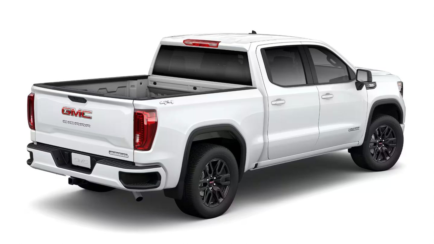2026 GMC Sierra - Rear three-quarter studio view of a white GMC Sierra Elevation showing the open truck bed - Applewood Chevrolet, Buick, GMC - New car dealership in Mississauga, Ontario