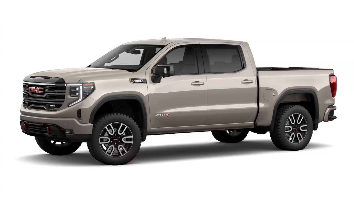 2026 GMC Sierra AT4 - Front three-quarter studio view of a sand-colored 2026 GMC Sierra AT4 pickup truck - City Chevrolet, Buick, GMC - New car dealership in Toronto, Ontario