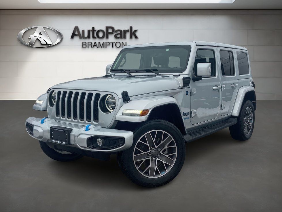 2026 Jeep Wrangler - Front three-quarter view of a silver 2026 Jeep Wrangler 4xe parked inside a showroom - AutoPark Brampton - New car dealership in Brampton, Ontario