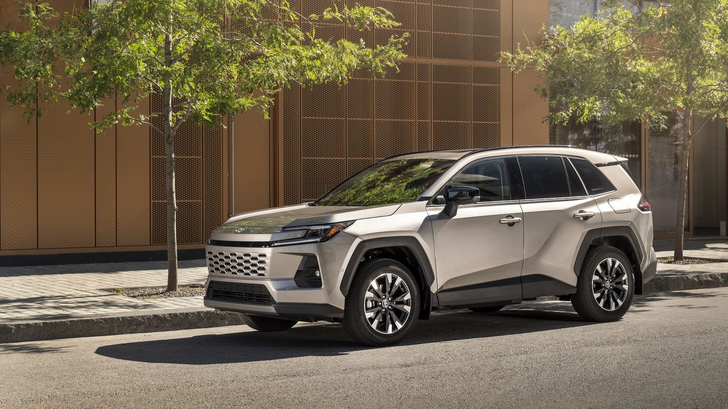 2026 Toyota RAV4 - Front three-quarter view of a silver Toyota RAV4 parked on a city street next to a sidewalk and modern building - Humberview Group - new car dealerships in Ontario