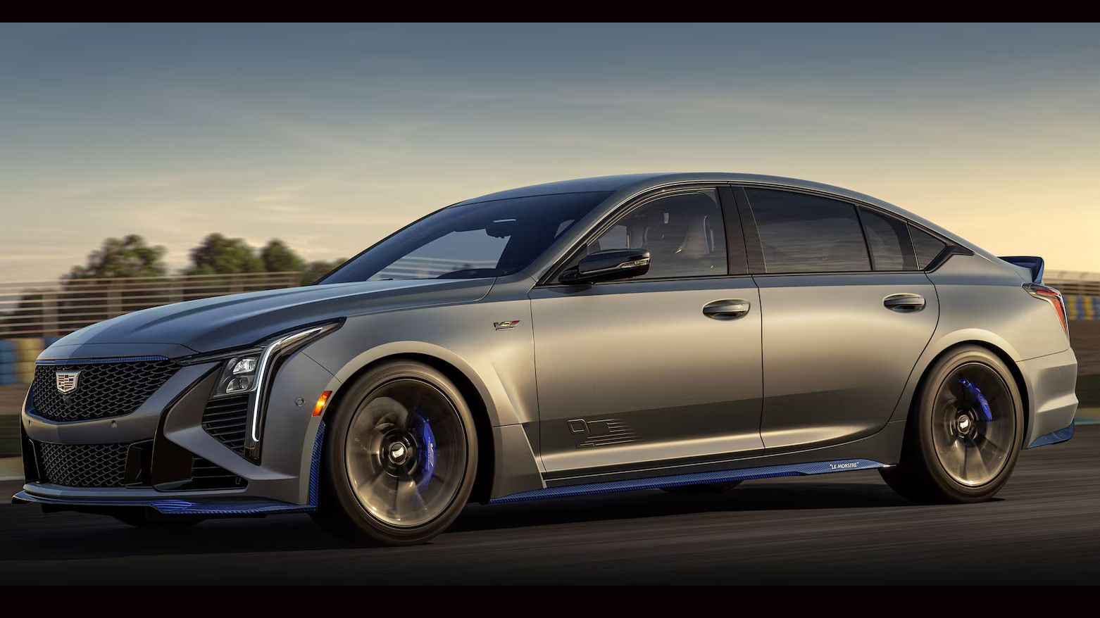 2026 Cadillac CT5-V Blackwing - A matte gray 2026 Cadillac CT5-V Blackwing Le Monstre Edition driving on a racetrack - Applewood Cadillac - Cadillac new car dealership in Mississauga, Ontario